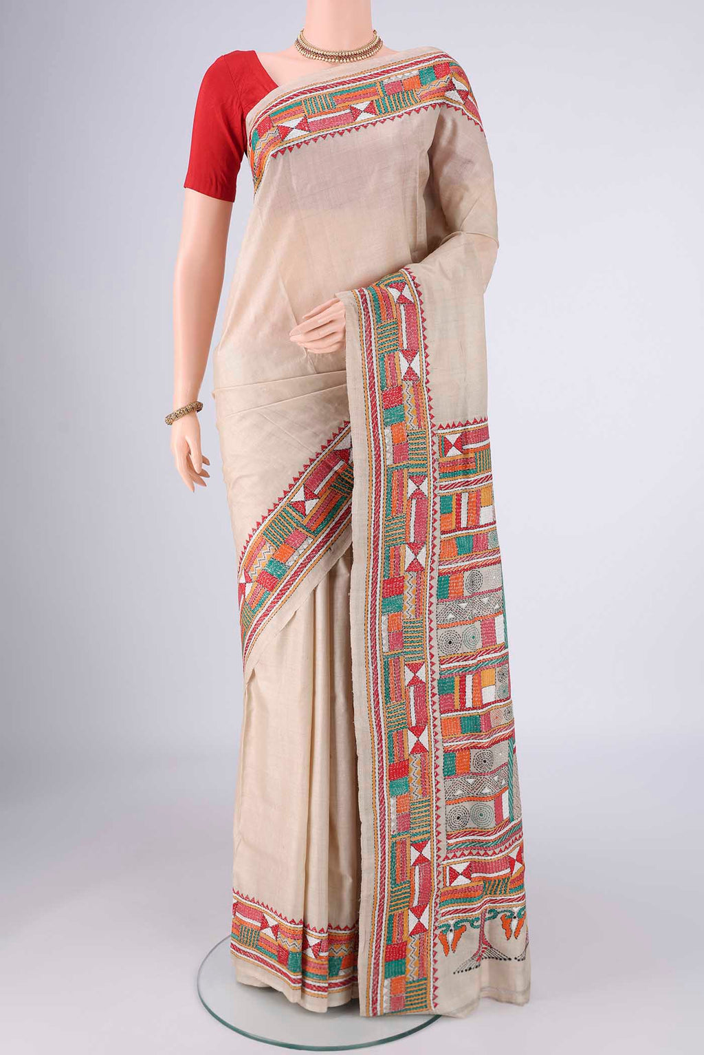 Beige Tussar Silk Saree with Kantha Work on the body and Thread Border.  displayed on a mannequin