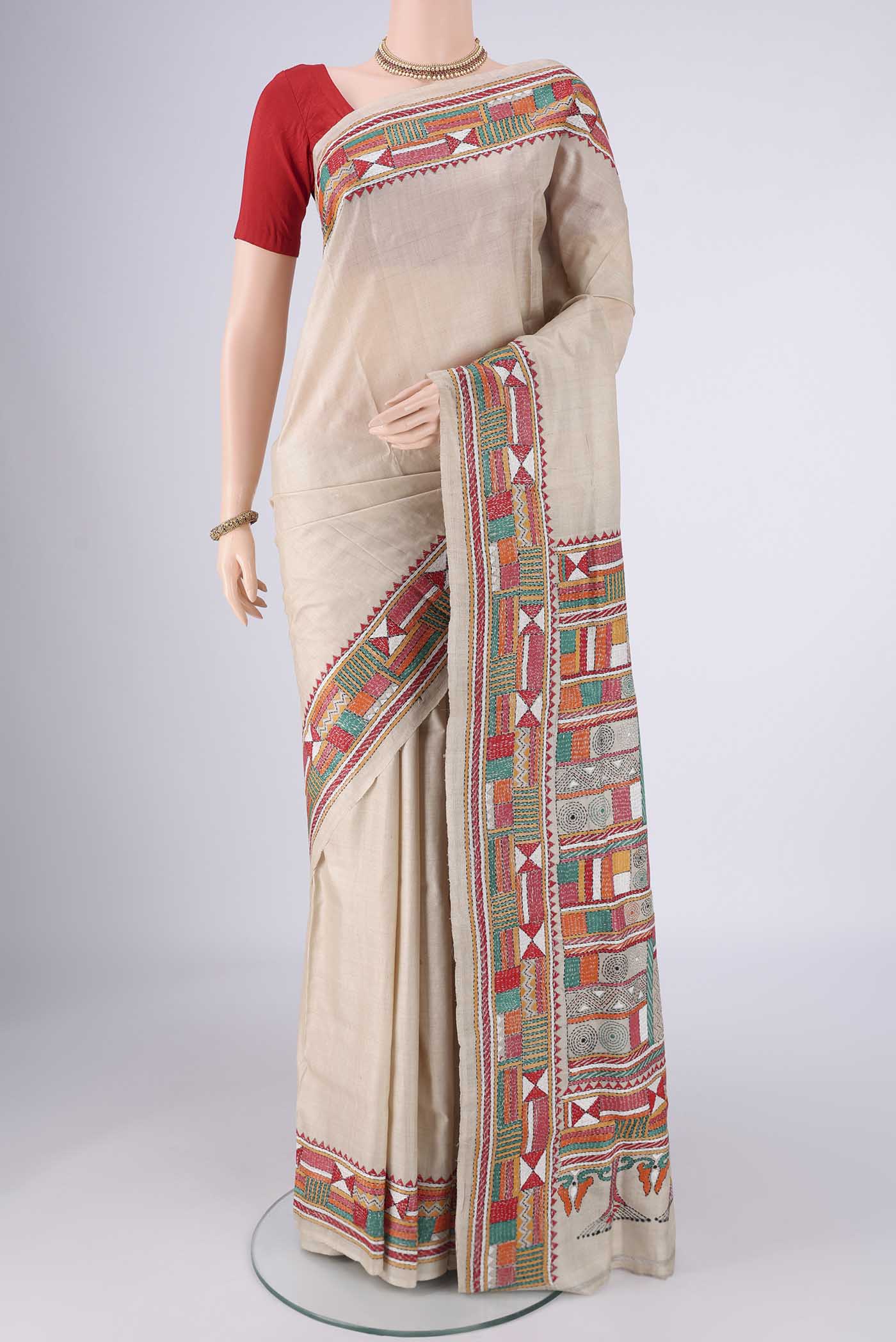 Beige Tussar Silk Saree with Kantha Work on the body and Thread Border.  displayed on a mannequin