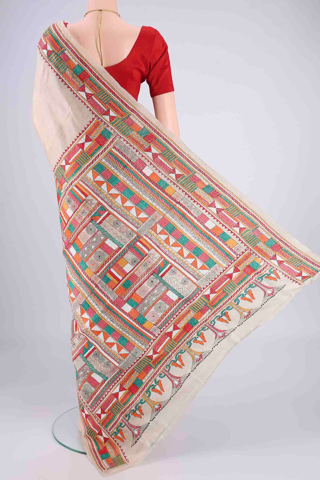 Flat view of Beige Tussar Silk Saree with Kantha Work on the body and Thread Border. 