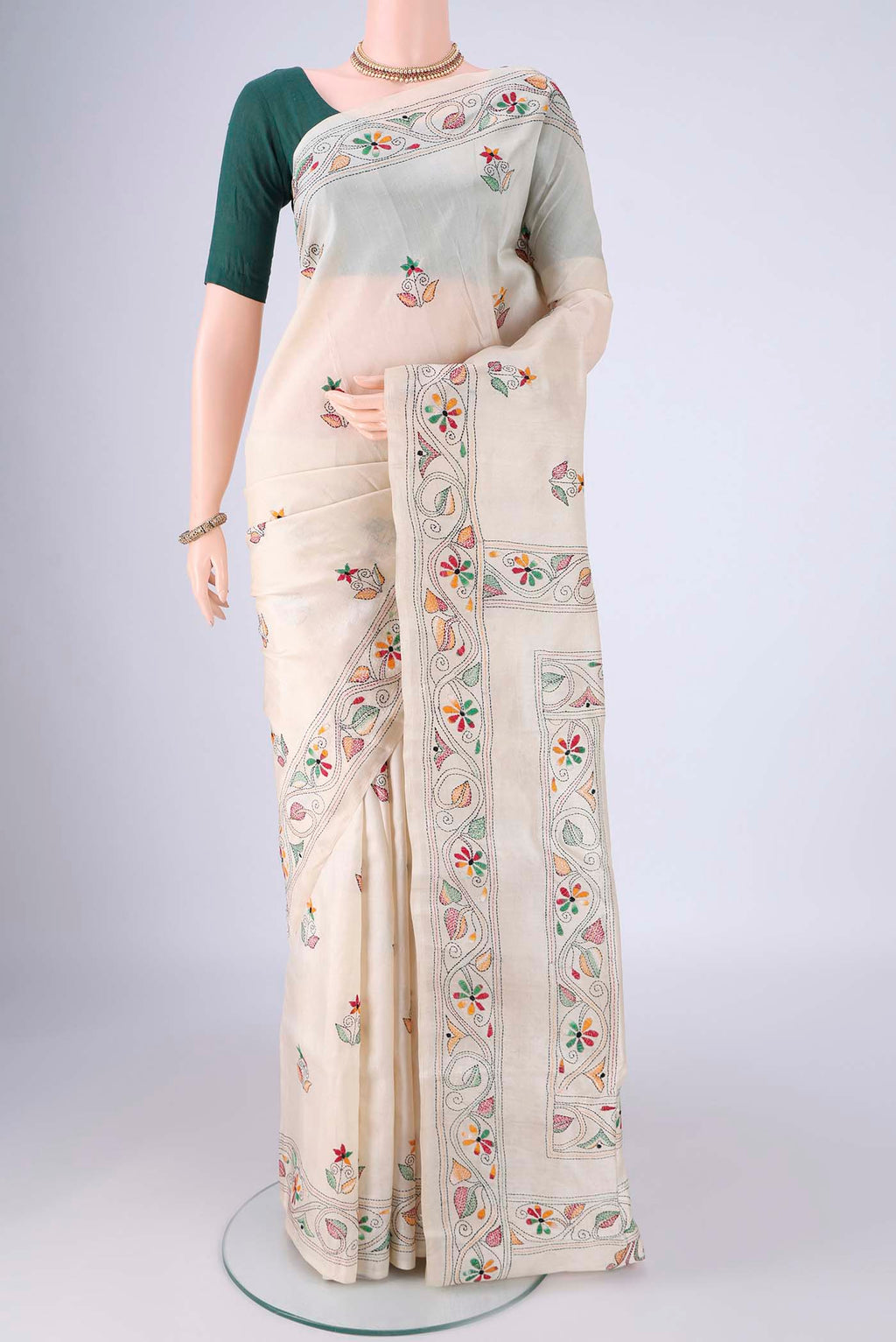 Cream Tussar Silk Saree with Kantha Work on the body and Embroidery Border.  displayed on a mannequin
