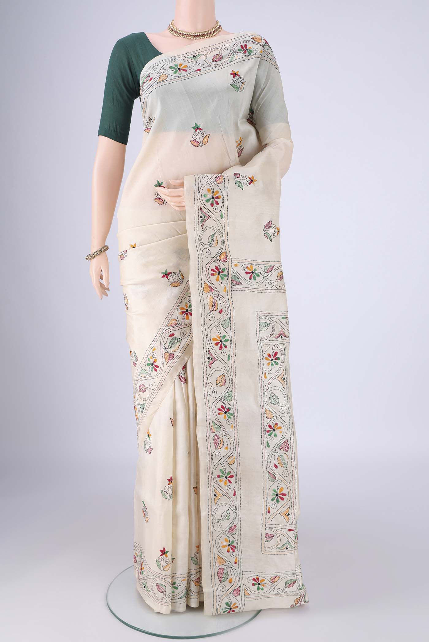 Cream Tussar Silk Saree with Kantha Work on the body and Embroidery Border.  displayed on a mannequin