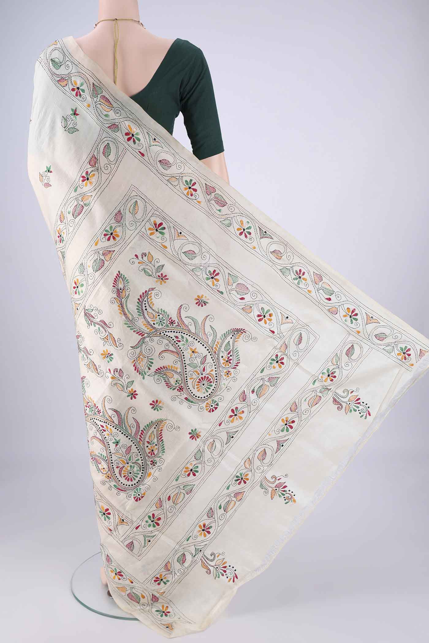 Flat view of Cream Tussar Silk Saree with Kantha Work on the body and Embroidery Border. 