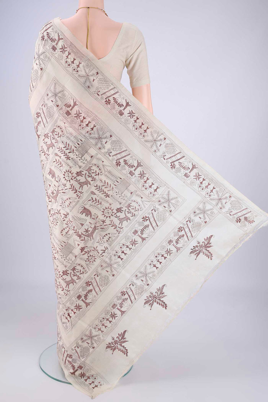 Flat view of Beige Tussar Silk Saree with Kantha Work on the body and Thread Border. 