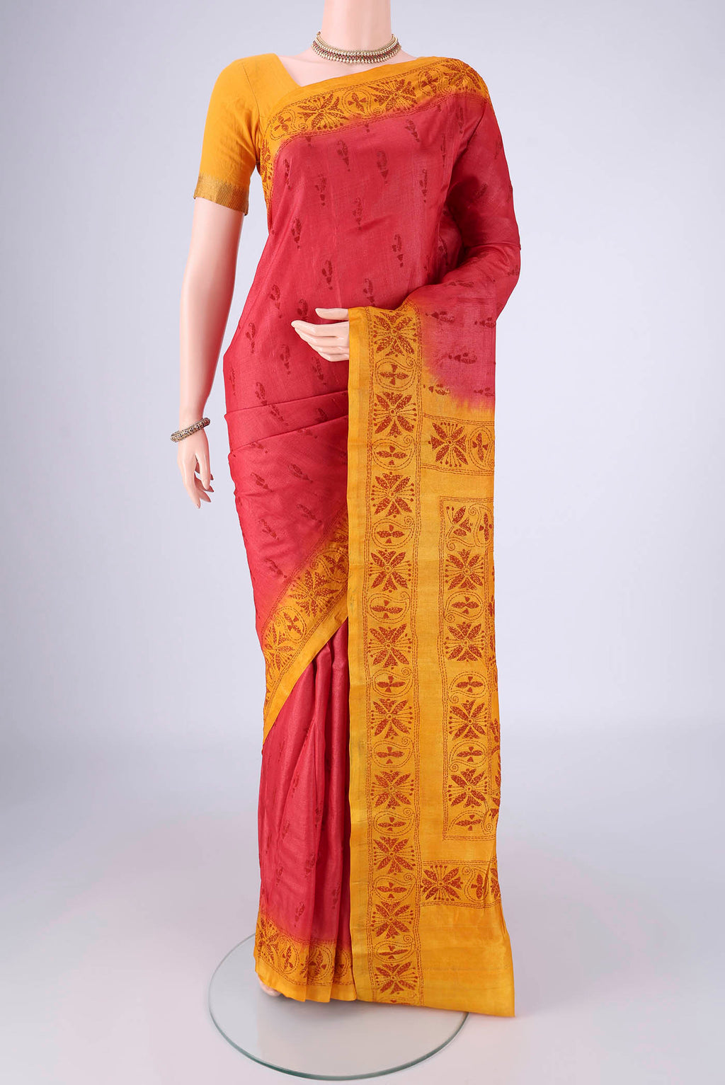 Coral Tussar Silk Saree with Kantha Work on the body and Thread Border.  displayed on a mannequin