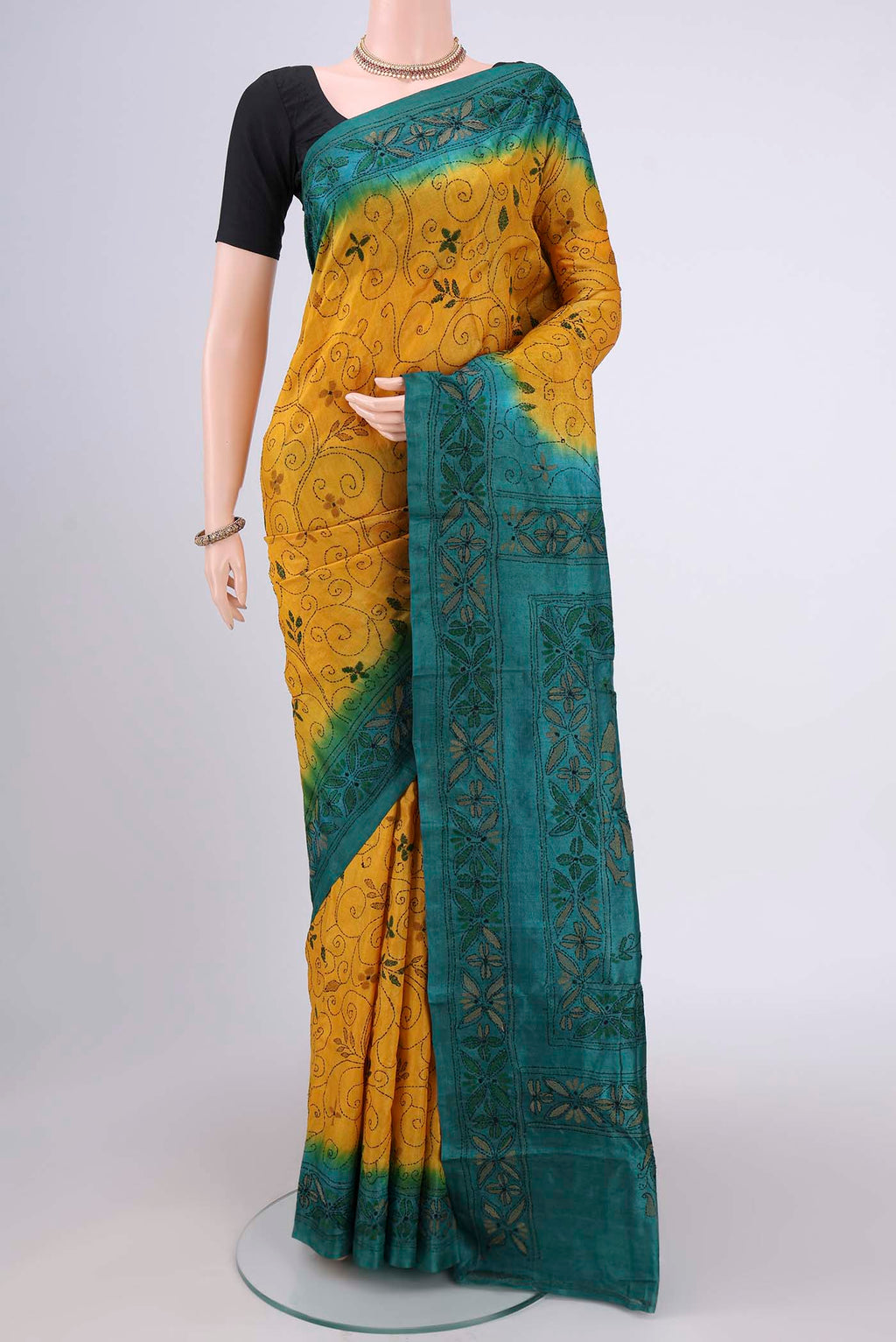Yellow Kantha Silk Saree with Kantha Work on the body and Thread Border.  displayed on a mannequin