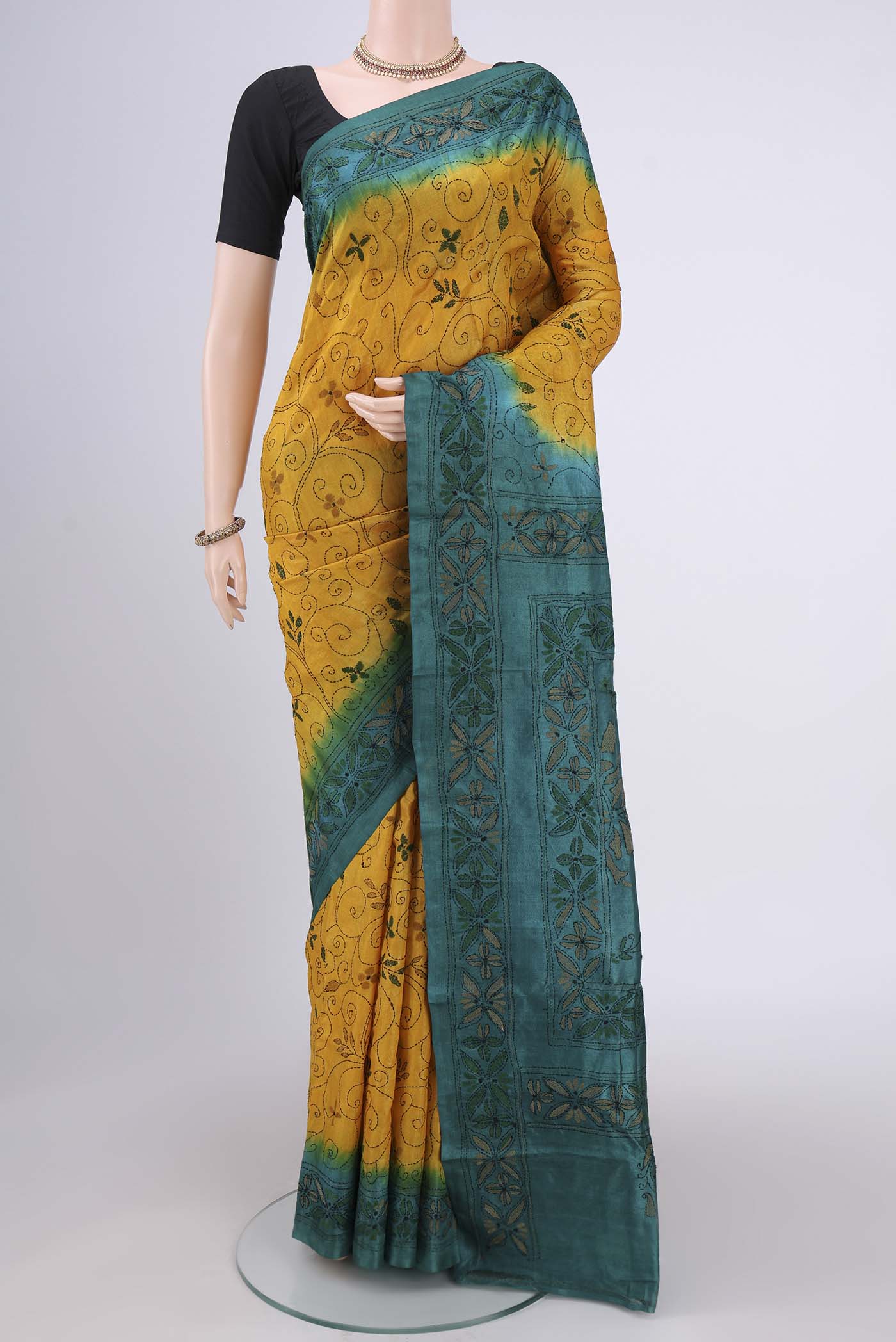 Yellow Kantha Silk Saree with Kantha Work on the body and Thread Border.  displayed on a mannequin