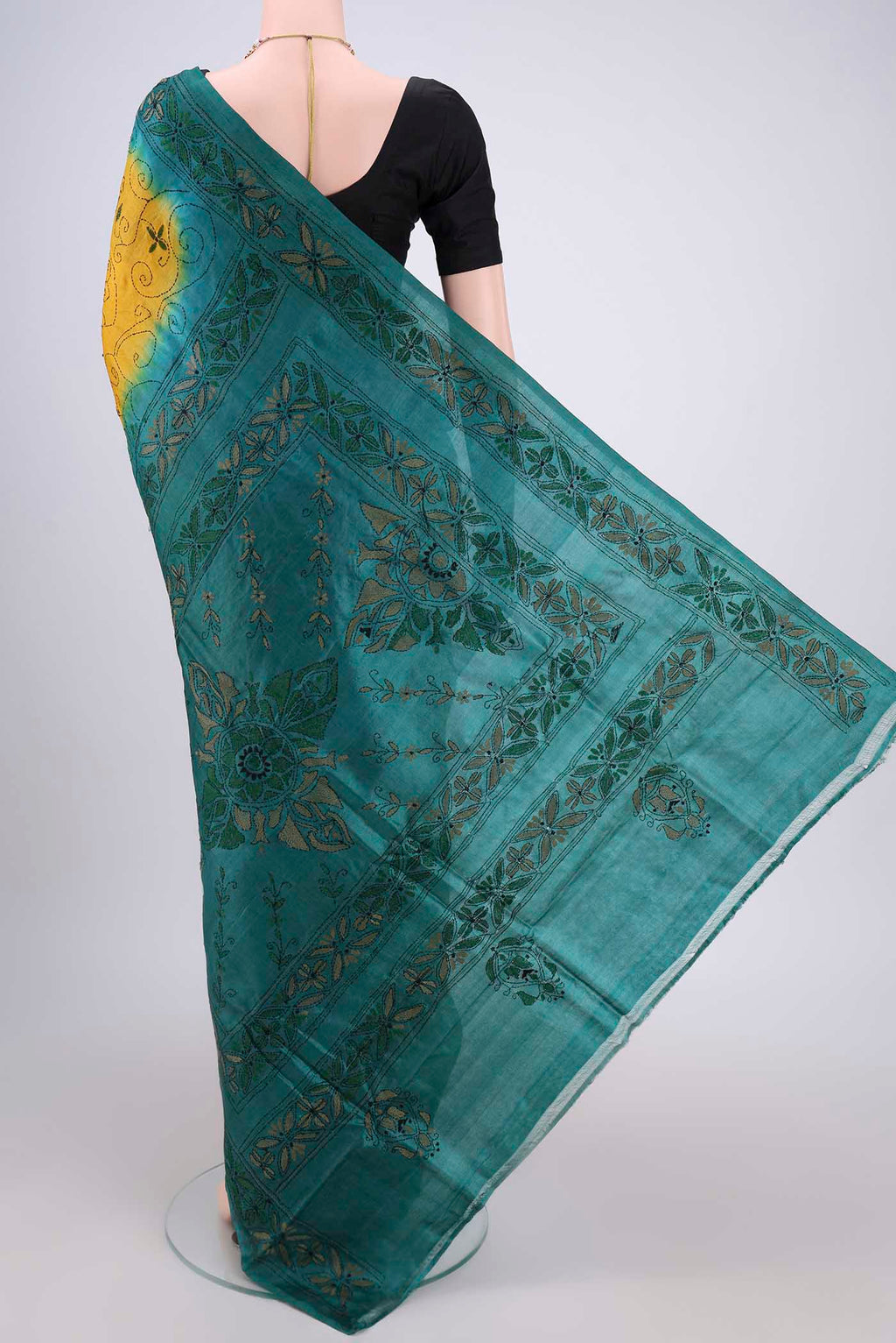 Flat view of Yellow Kantha Silk Saree with Kantha Work on the body and Thread Border. 