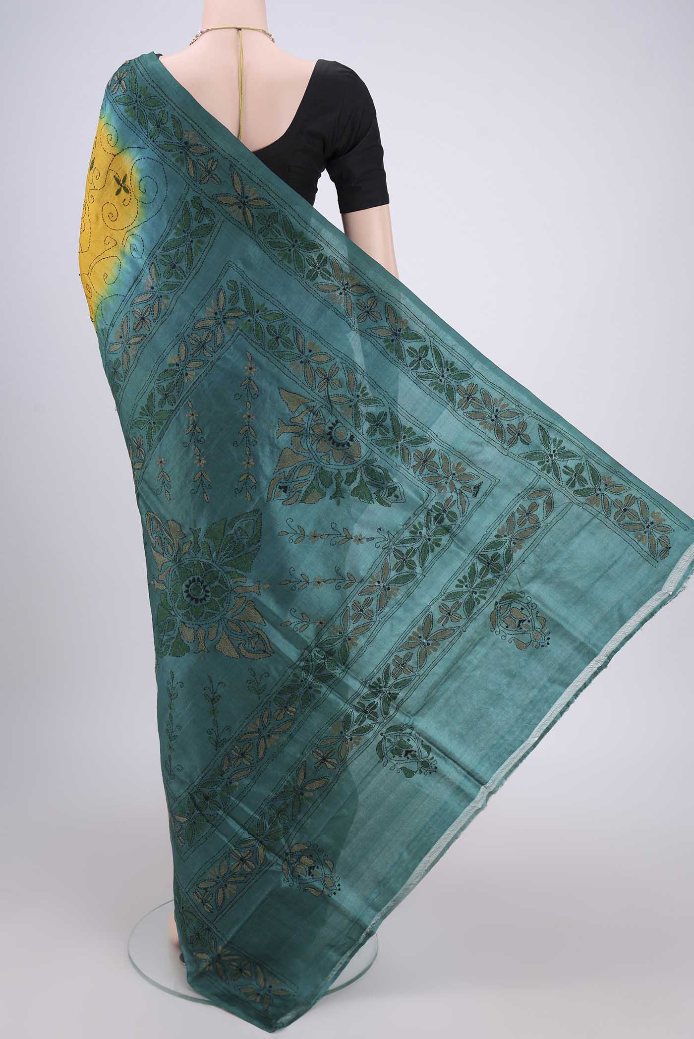 Flat view of Yellow Kantha Silk Saree with Kantha Work on the body and Thread Border. 