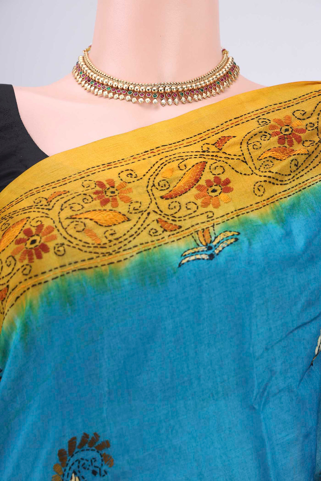 Border image of Blue Kantha Silk Saree with Kantha Work on the body and Thread Border. 