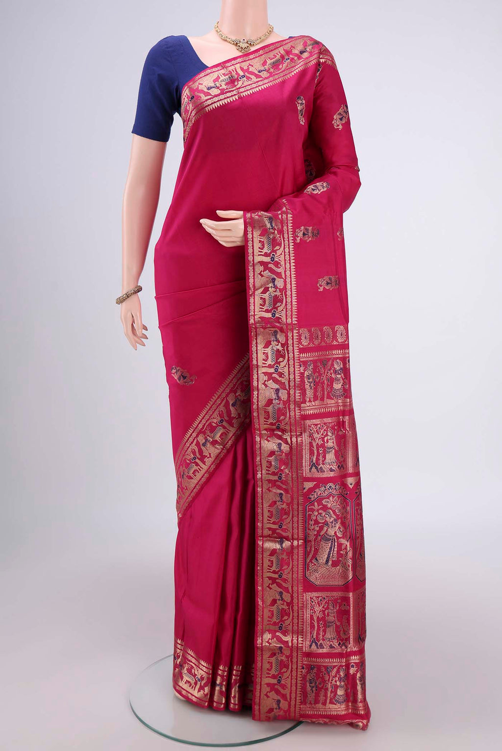 Rani Pink Baluchari Silk Saree with Zari And Thread Butta on the body and Zari And Thread Border.  displayed on a mannequin