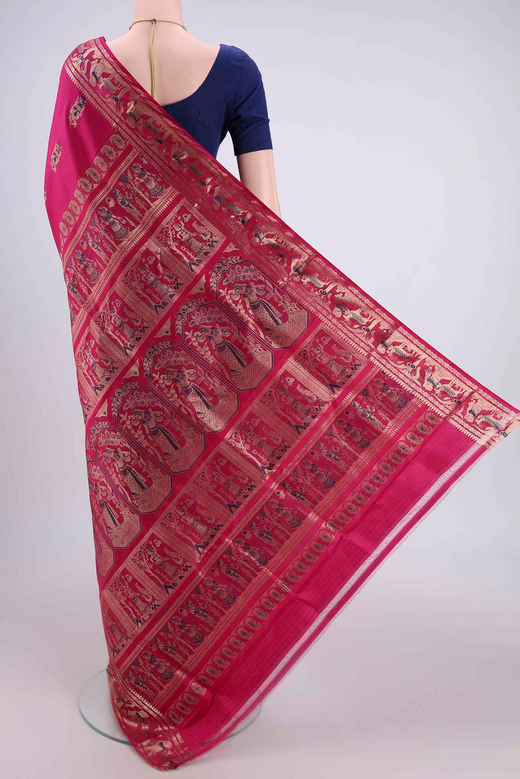 Flat view of Rani Pink Baluchari Silk Saree with Zari And Thread Butta on the body and Zari And Thread Border. 