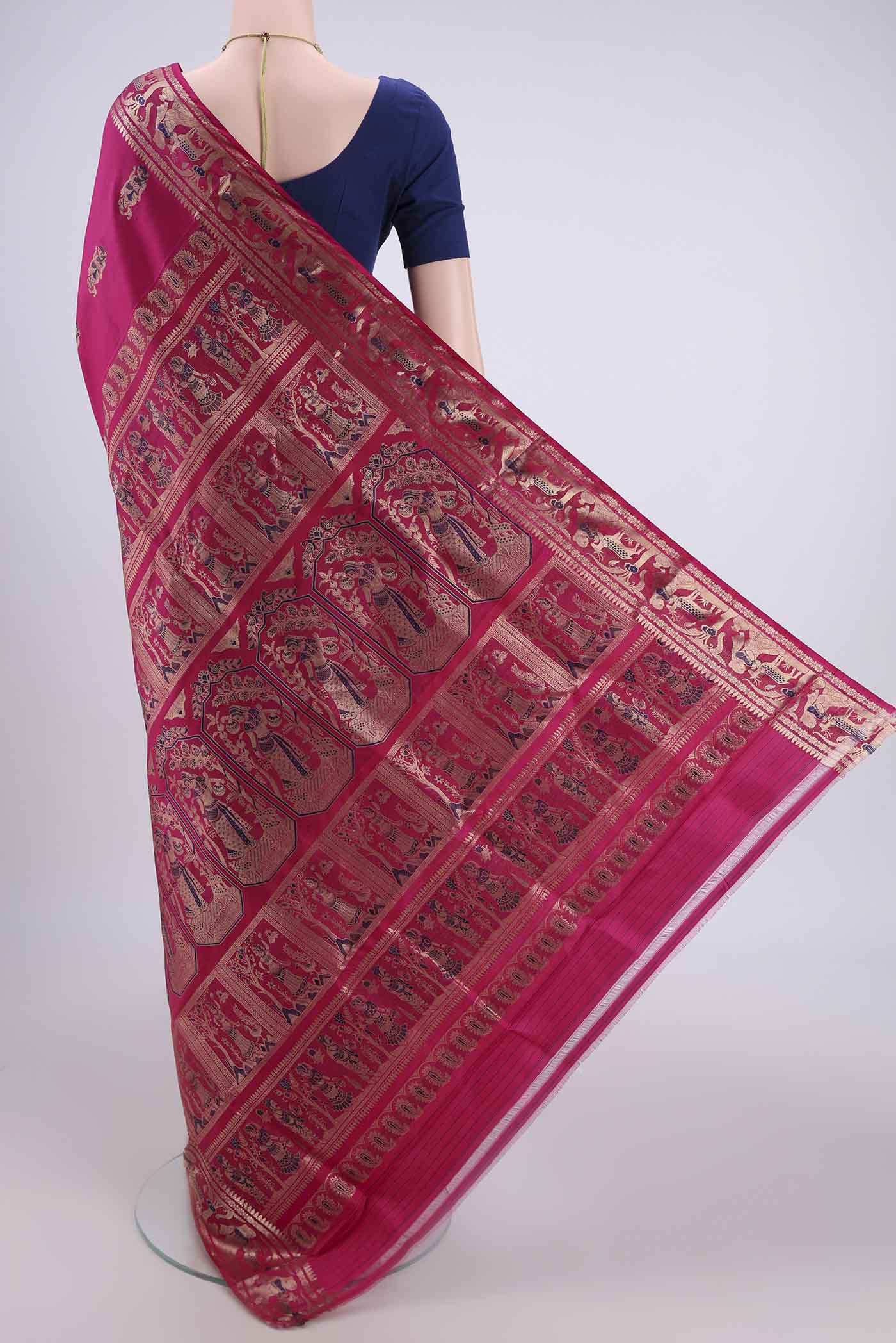 Flat view of Rani Pink Baluchari Silk Saree with Zari And Thread Butta on the body and Zari And Thread Border. 