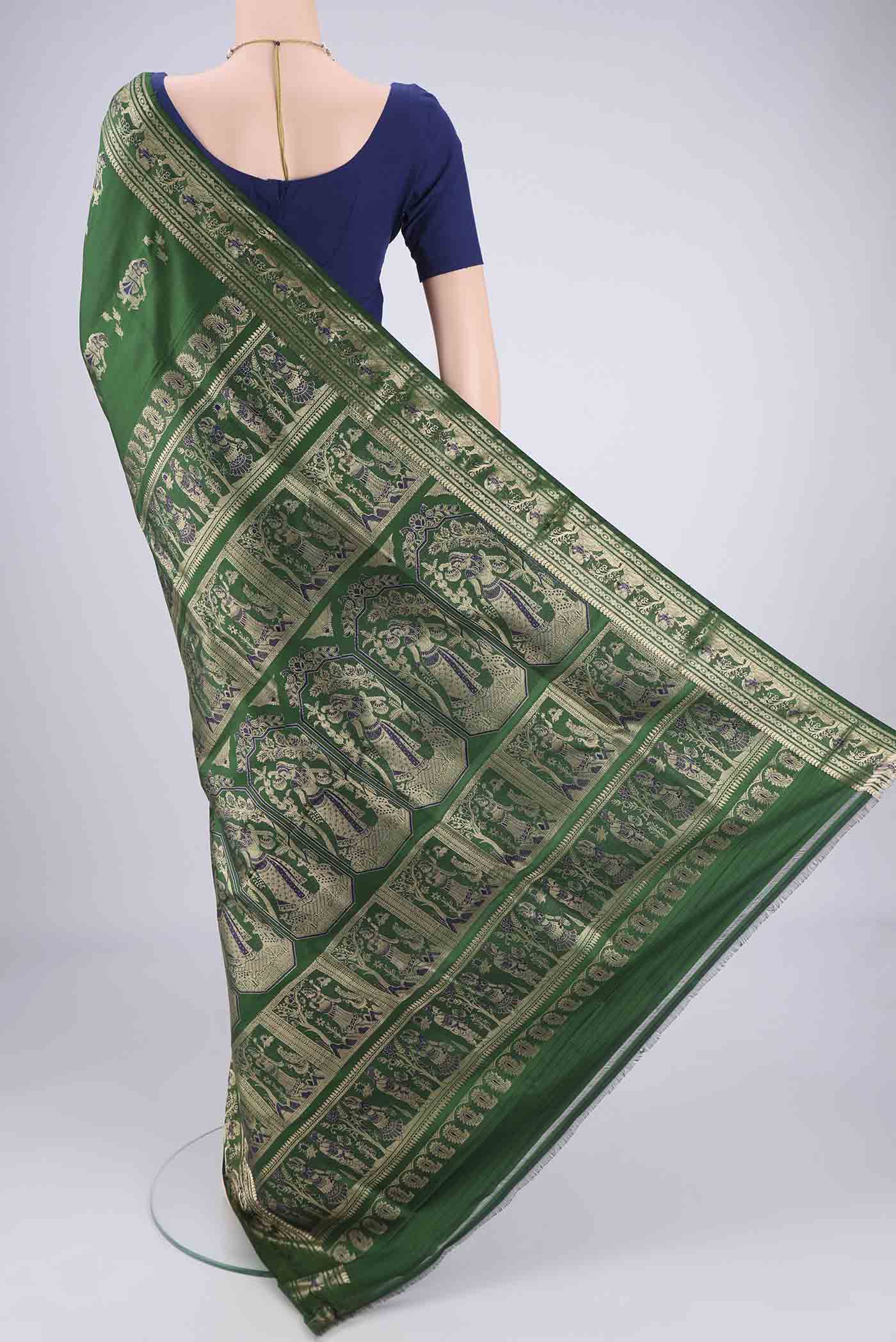 Flat view of Bottle Green Baluchari Silk Saree with Zari And Thread Butta on the body and Zari And Thread Border. 