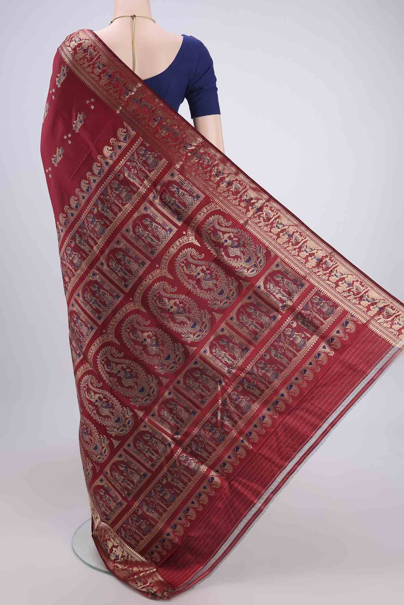 Flat view of Maroon Baluchari Silk Saree with Zari And Thread Butta on the body and Zari And Thread Border. 
