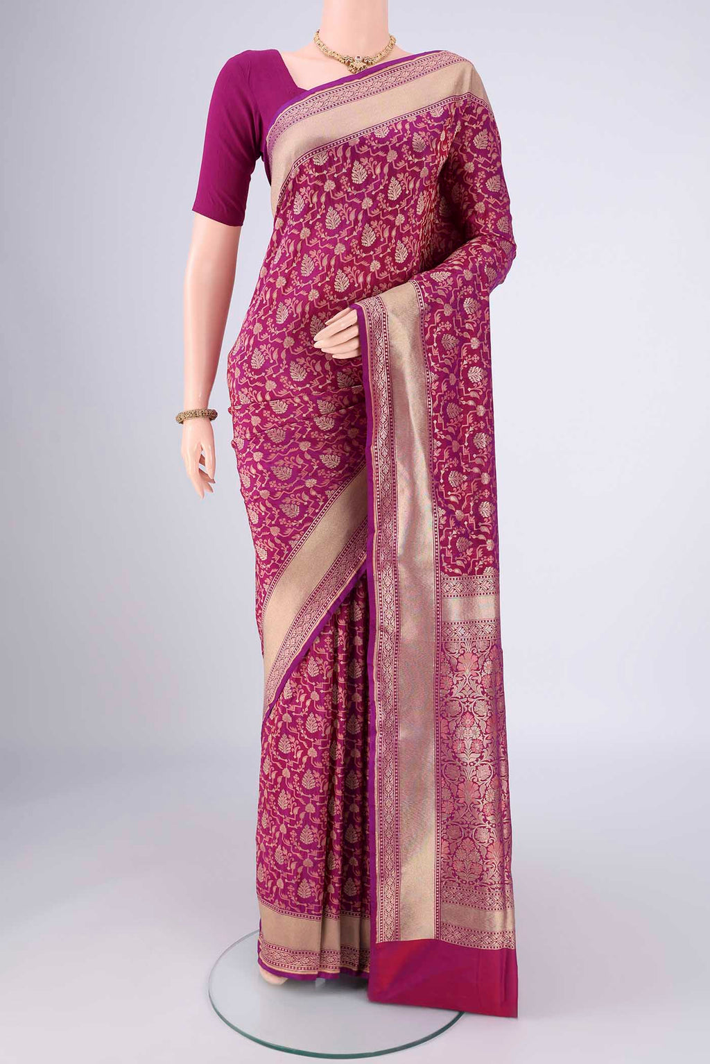 Magenta Banarasi Silk Saree with Jacquard With Zari Butta on the body and Zari Border.  displayed on a mannequin