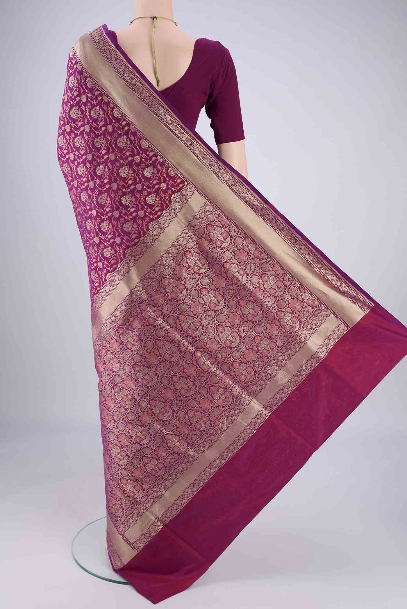Flat view of Magenta Banarasi Silk Saree with Jacquard With Zari Butta on the body and Zari Border. 
