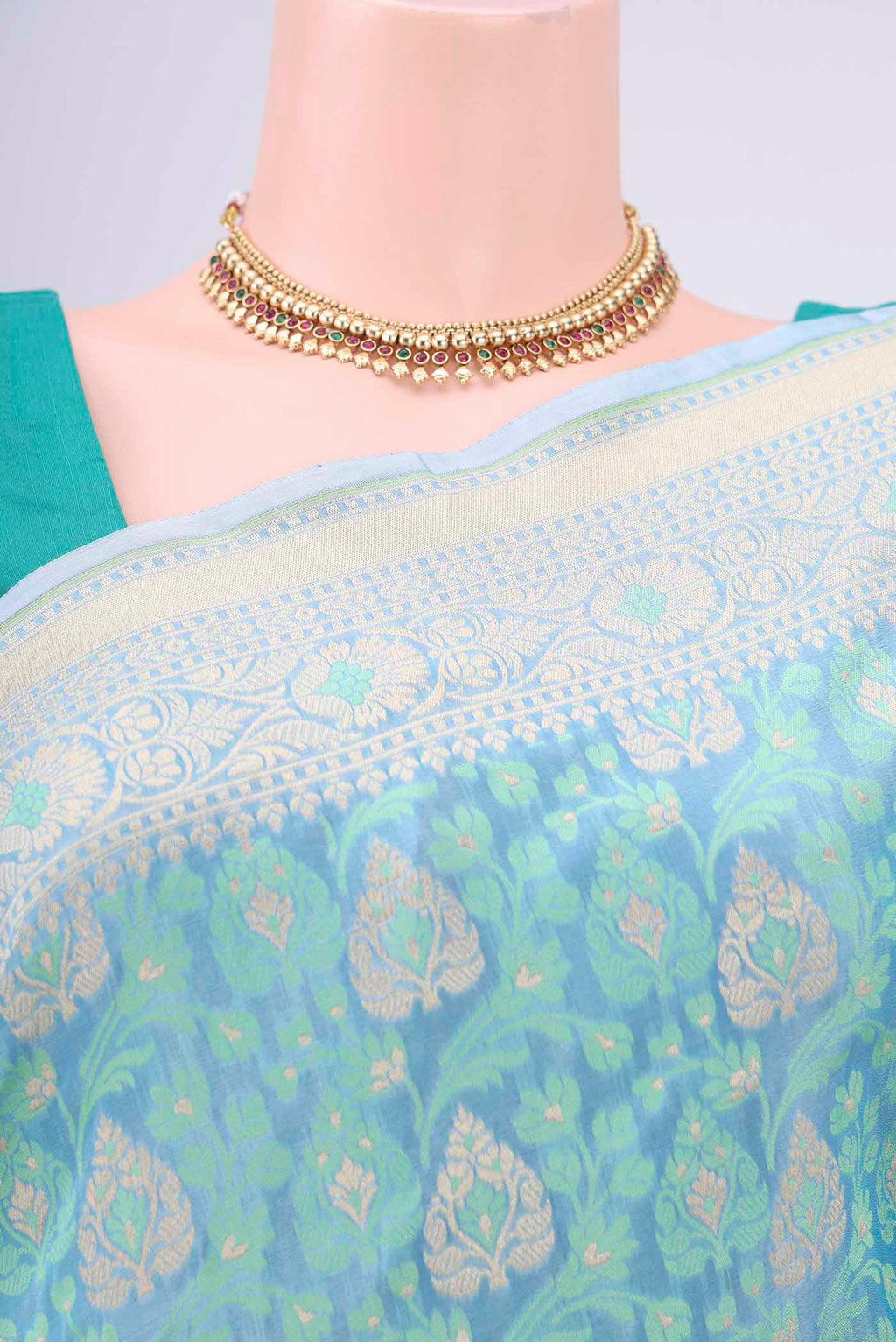 Border image of Sky Blue Banarasi Silk Saree with Zari And Thread Butta on the body and Zari Border. 