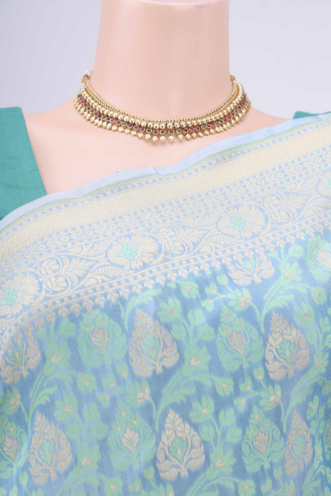 Border image of Sky Blue Banarasi Silk Saree with Zari And Thread Butta on the body and Zari Border. 