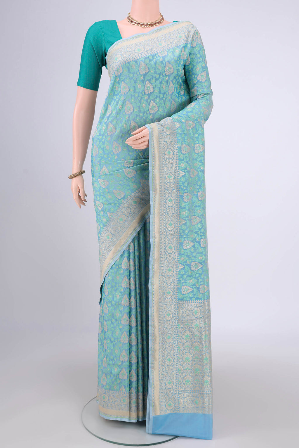 Sky Blue Banarasi Silk Saree with Zari And Thread Butta on the body and Zari Border.  displayed on a mannequin