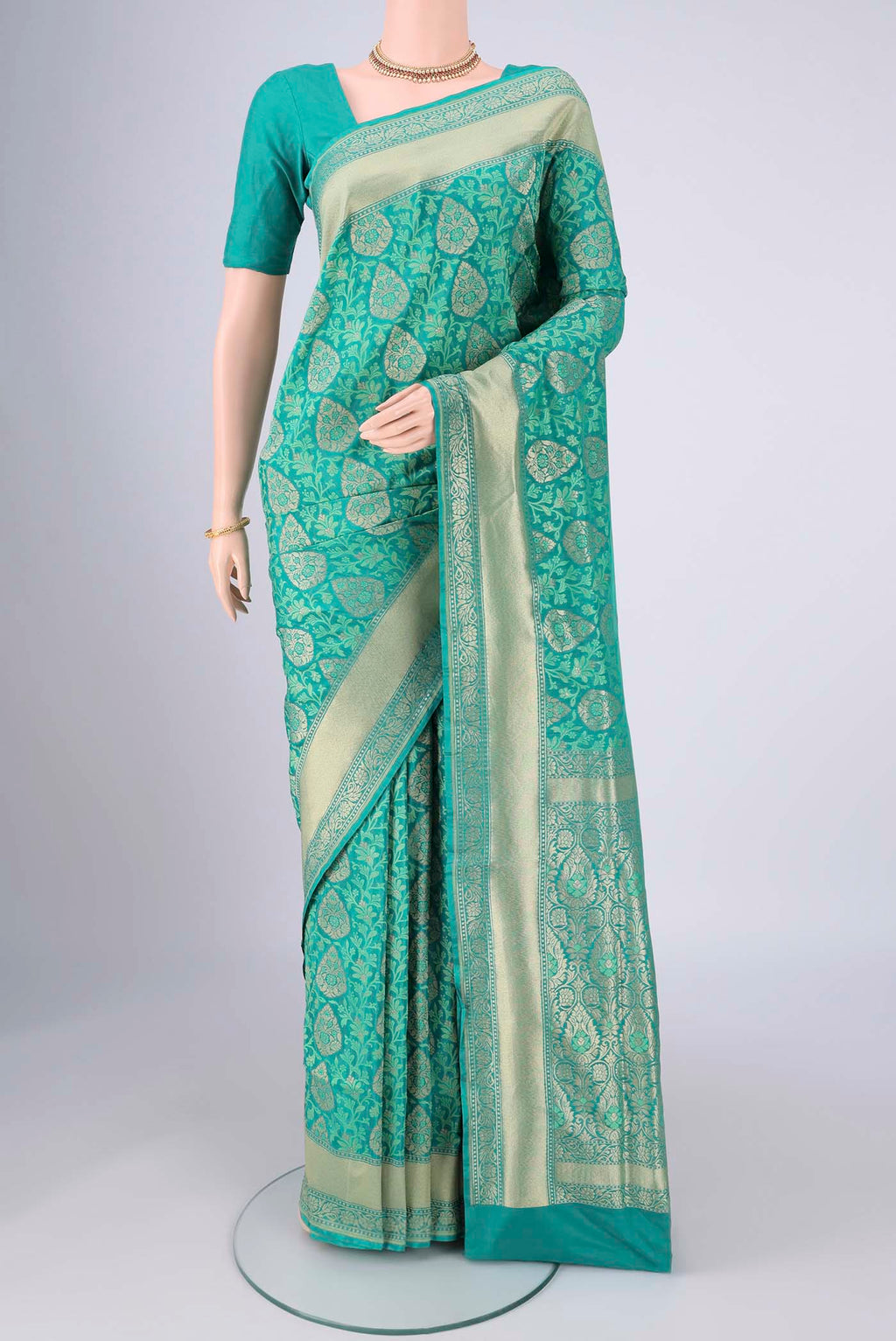 Turquoise Banarasi Silk Saree with Jacquard With Zari Butta on the body and Zari And Thread Border.  displayed on a mannequin