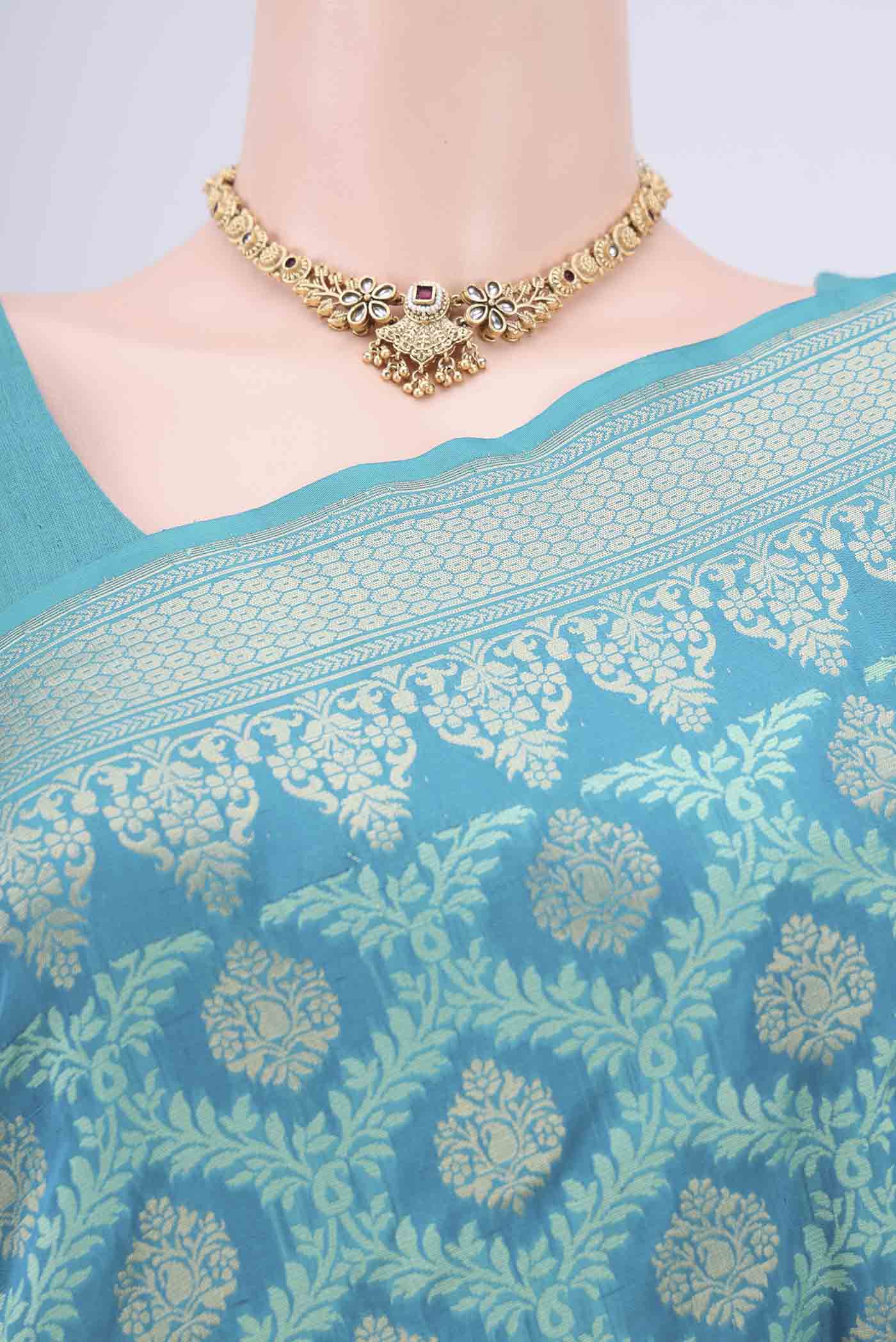 Border image of Sea Green Banarasi Silk Saree with Zari And Thread Butta on the body and Zari Border. 