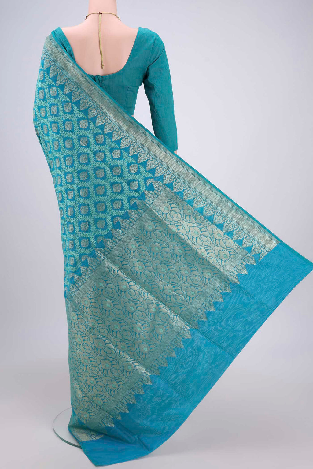 Flat view of Sea Green Banarasi Silk Saree with Zari And Thread Butta on the body and Zari Border. 