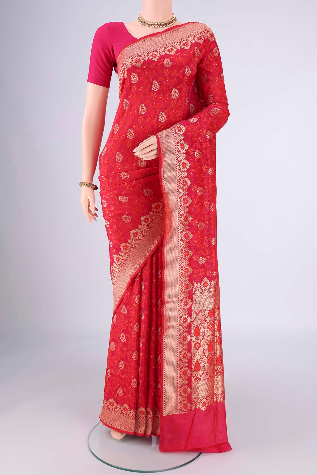 Red Banarasi Silk Saree with Jacquard With Zari Butta on the body and Zari And Thread Border.  displayed on a mannequin
