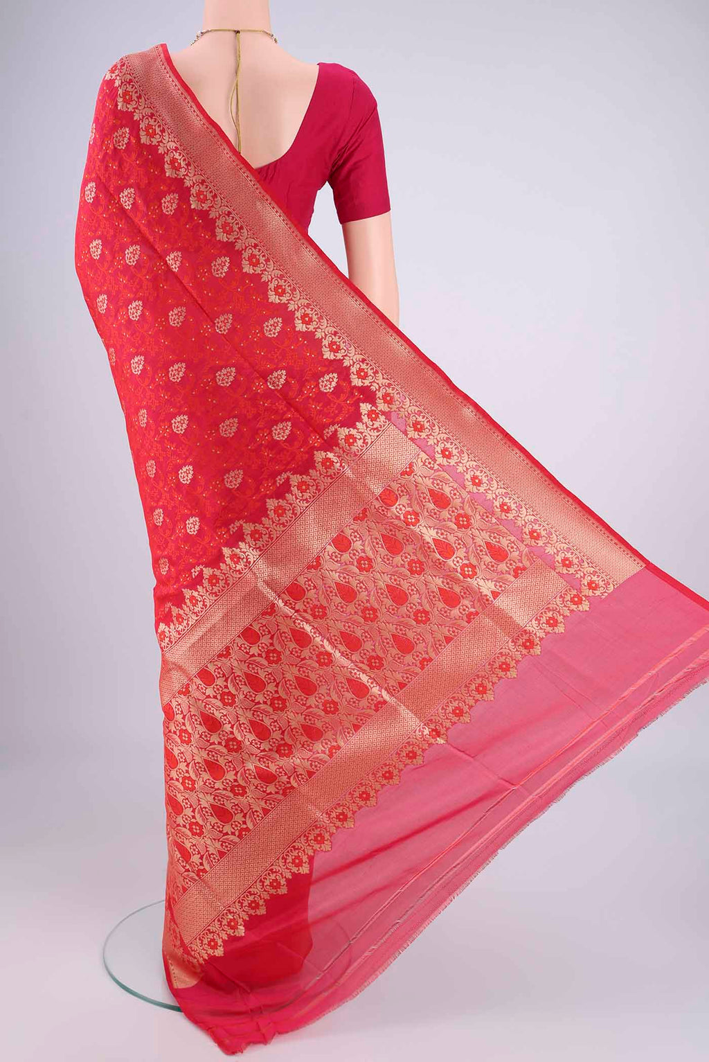 Flat view of Red Banarasi Silk Saree with Jacquard With Zari Butta on the body and Zari And Thread Border. 