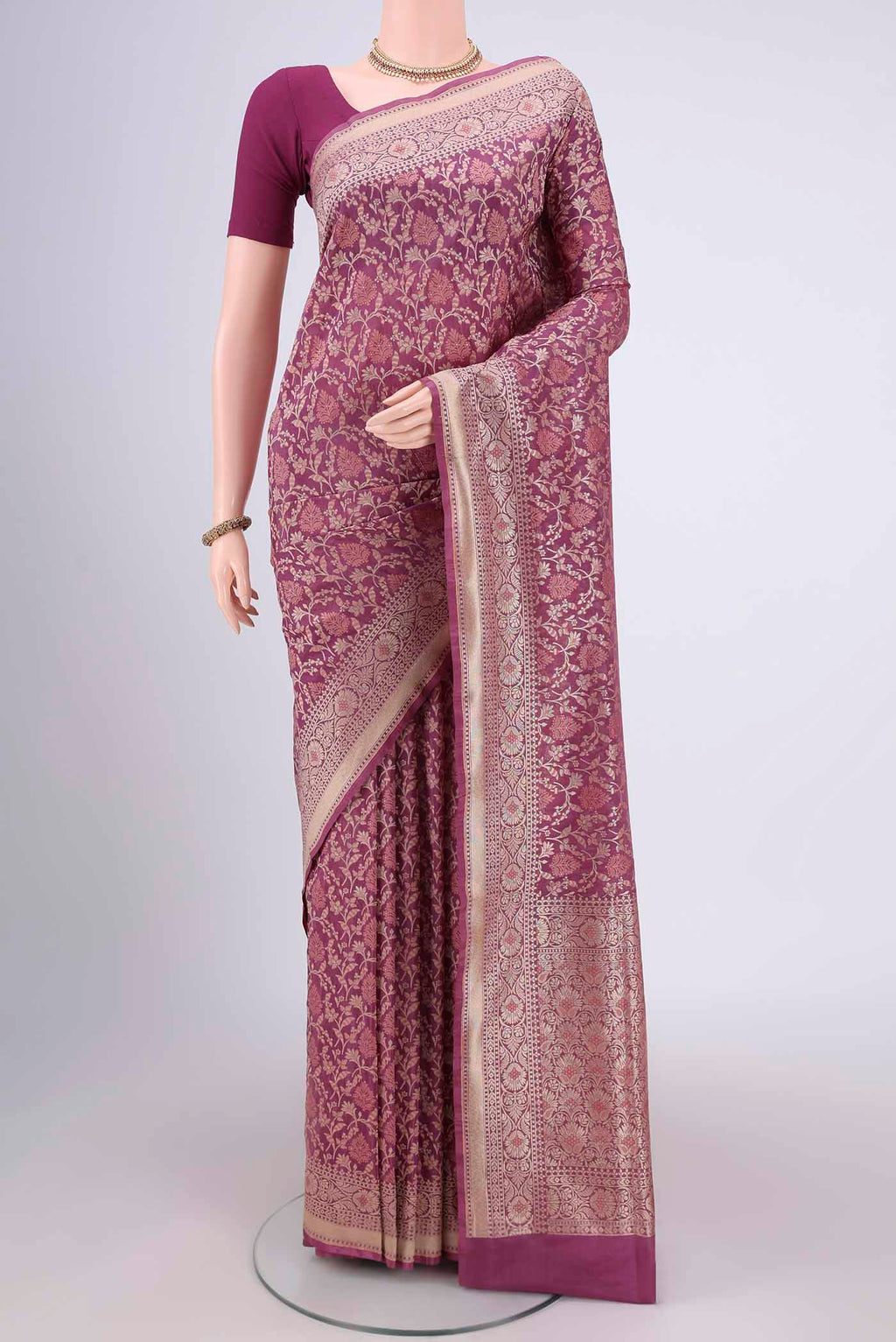 Rose Gold Banarasi Silk Saree with Zari And Thread Butta on the body and Zari Border.  displayed on a mannequin