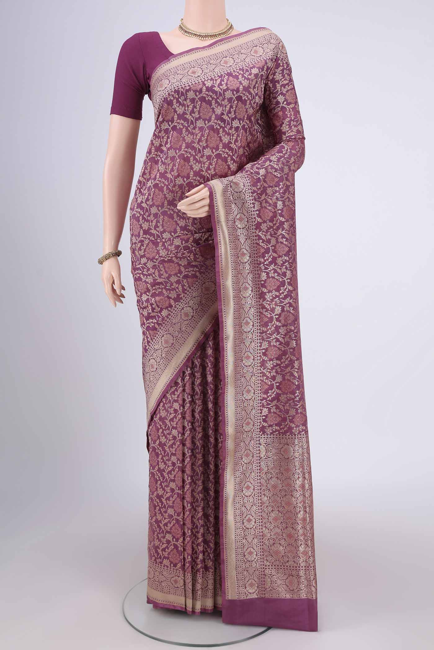 Rose Gold Banarasi Silk Saree with Zari And Thread Butta on the body and Zari Border.  displayed on a mannequin