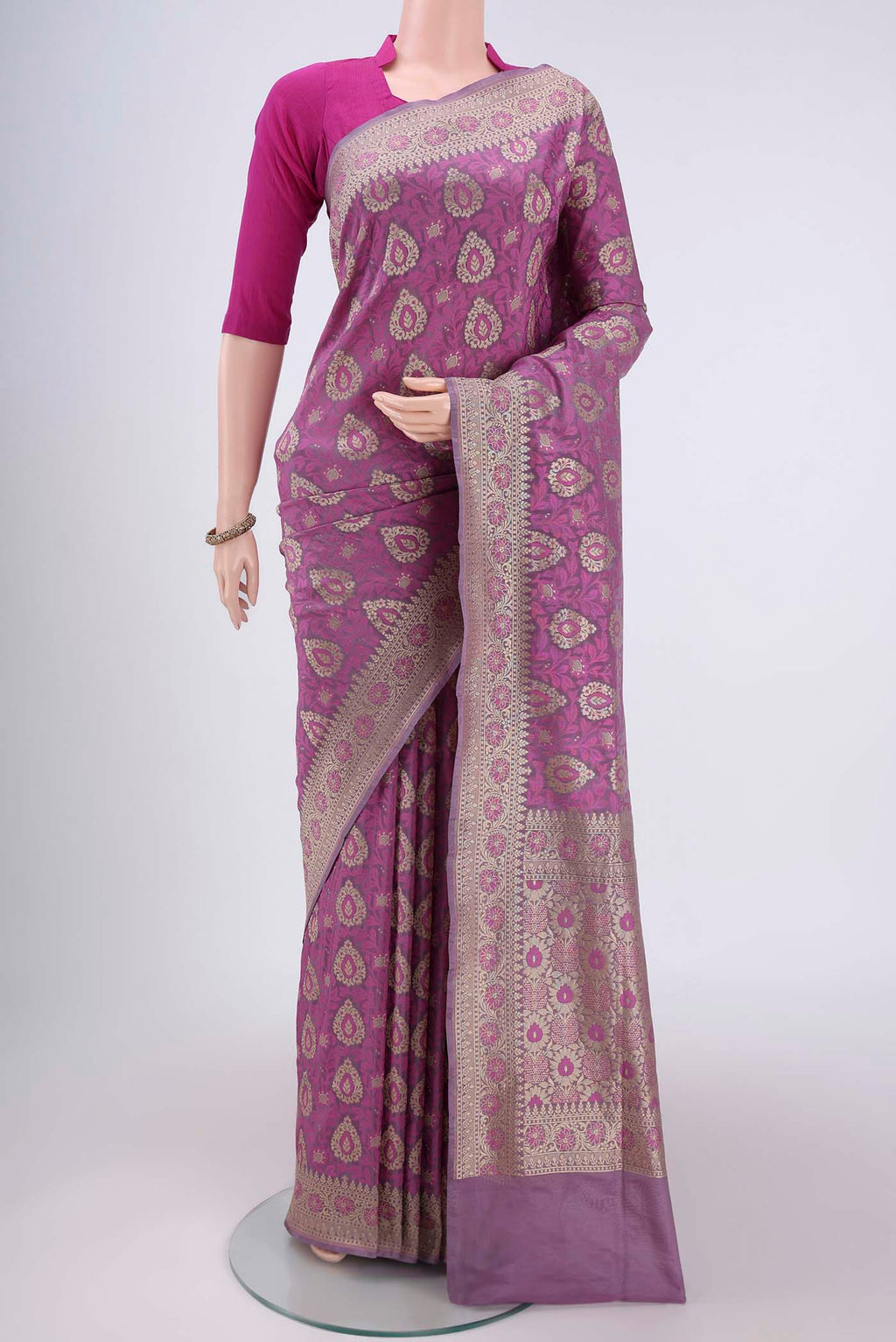 Light Magenta Banarasi Silk Saree with Zari And Thread Butta on the body and Zari Border.  displayed on a mannequin