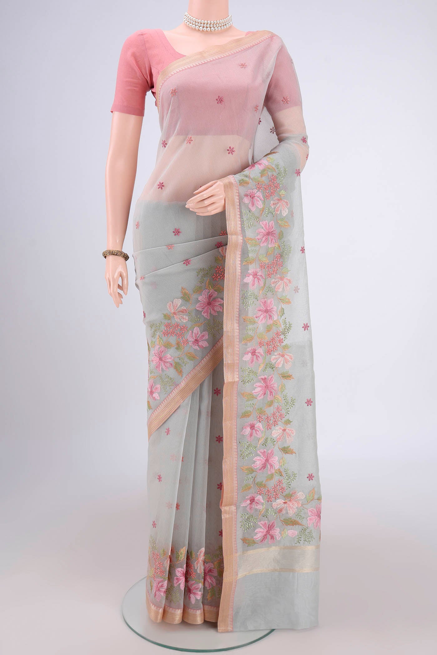 Grey Blended Kota Cotton Saree with Embroidery on the body and Zari Border.  displayed on a mannequin