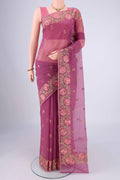 Magenta Blended Kota Cotton Saree with Embroidery on the body and Temple Border.  displayed on a mannequin