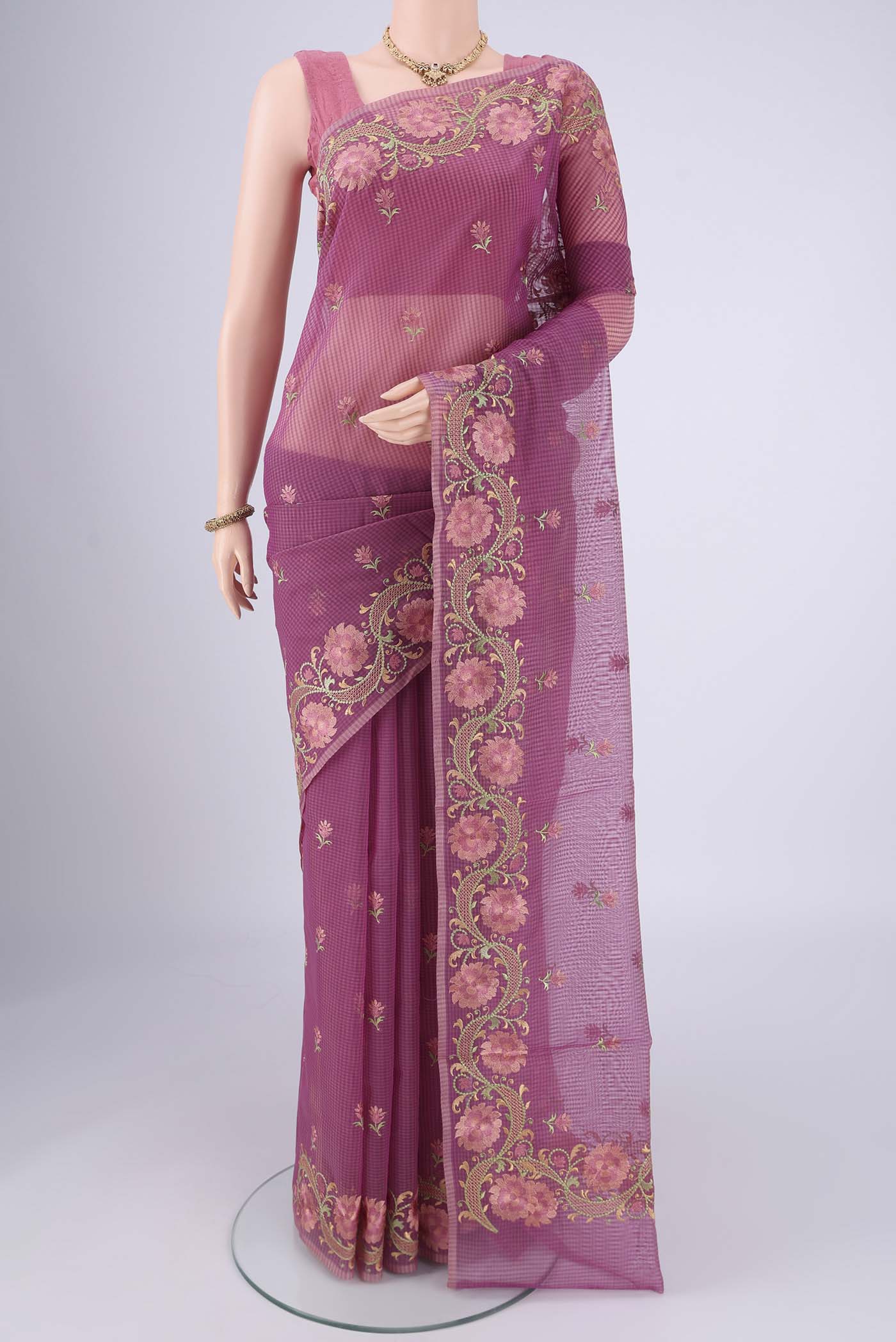 Magenta Blended Kota Cotton Saree with Embroidery on the body and Temple Border.  displayed on a mannequin