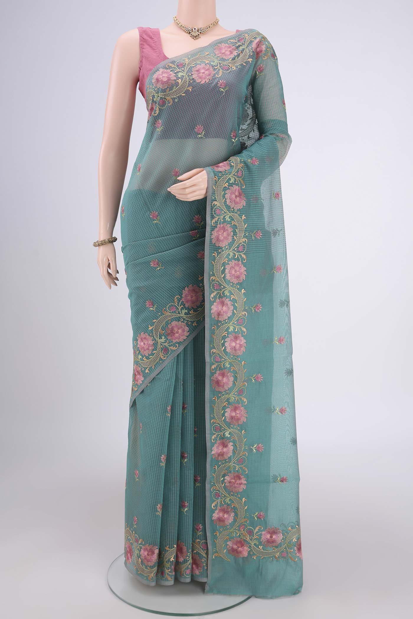 Sea Green Blended Kota Cotton Saree with Embroidery on the body and Embroidery Border.  displayed on a mannequin