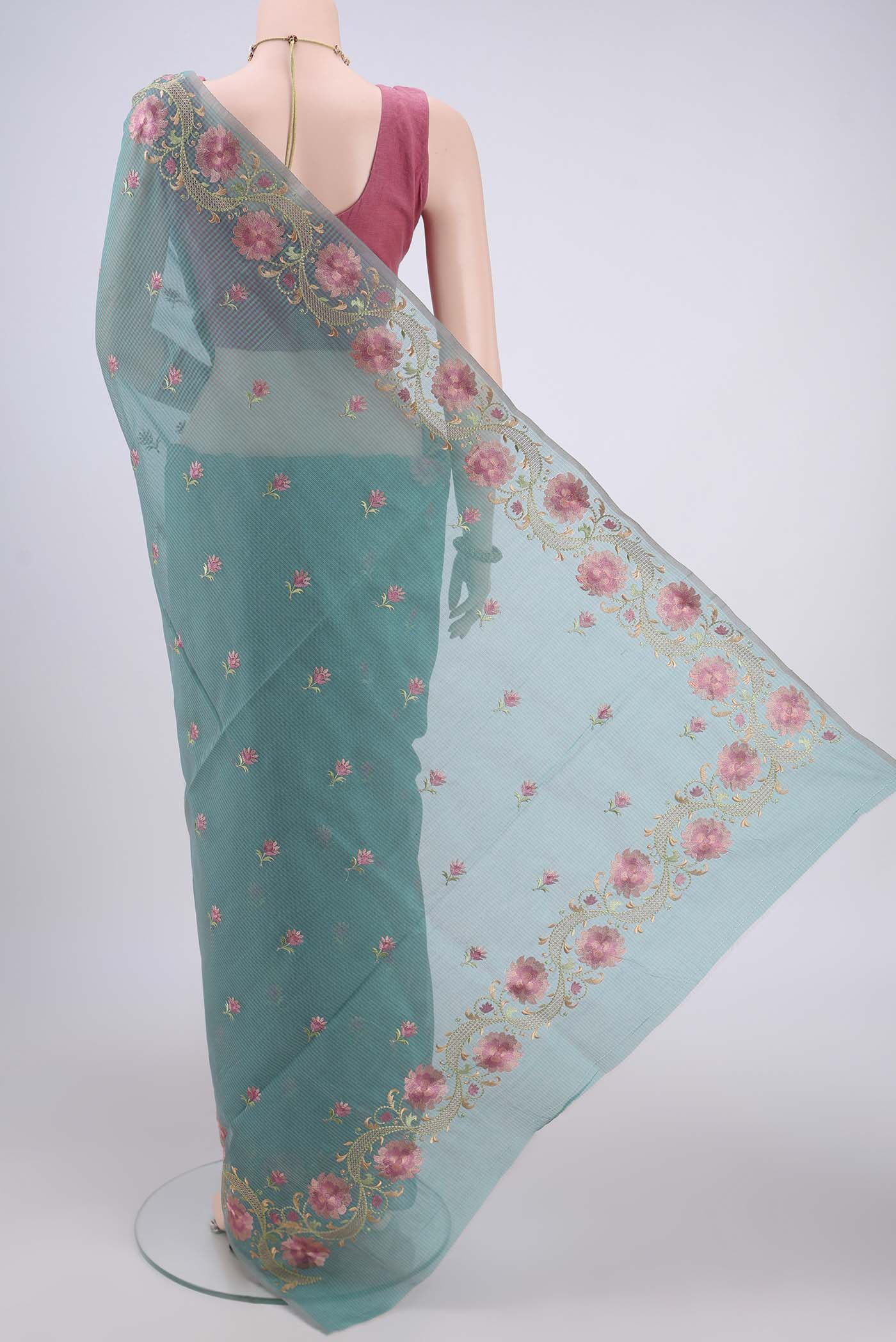 Flat view of Sea Green Blended Kota Cotton Saree with Embroidery on the body and Embroidery Border. 