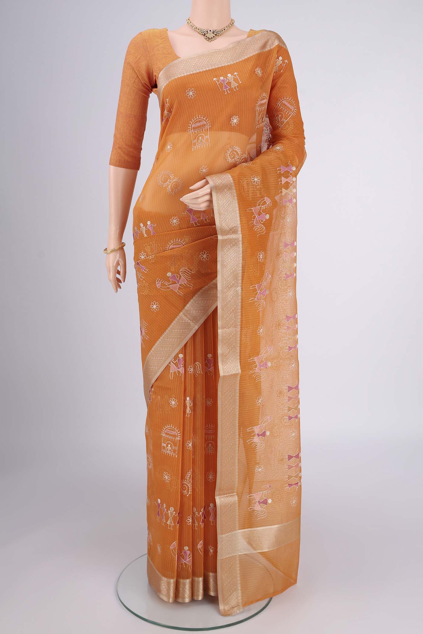 Brick Orange Dual Tone Blended Kota Cotton Saree with Embroidery on the body and Zari Border.  displayed on a mannequin