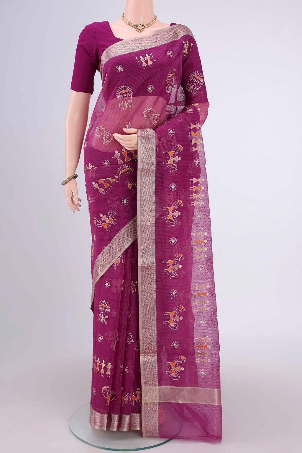 Magenta Blended Kota Cotton Saree with Embroidery on the body and Zari Border.  displayed on a mannequin