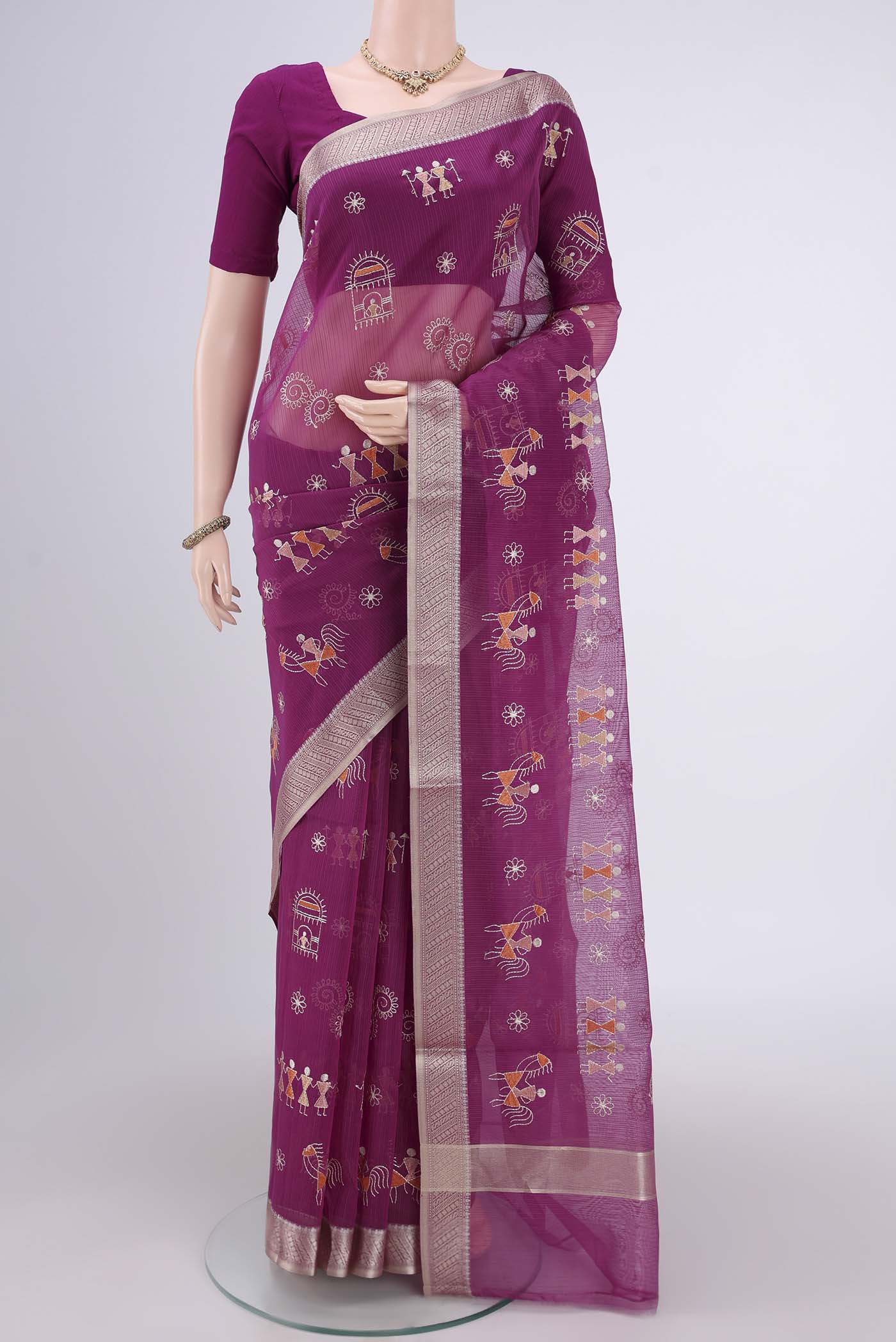 Magenta Blended Kota Cotton Saree with Embroidery on the body and Zari Border.  displayed on a mannequin