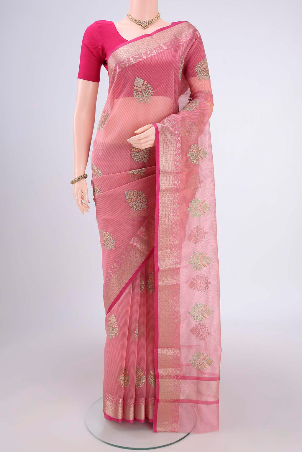 Pink Blended Kota Cotton Saree with Embroidery on the body and Zari Border.  displayed on a mannequin