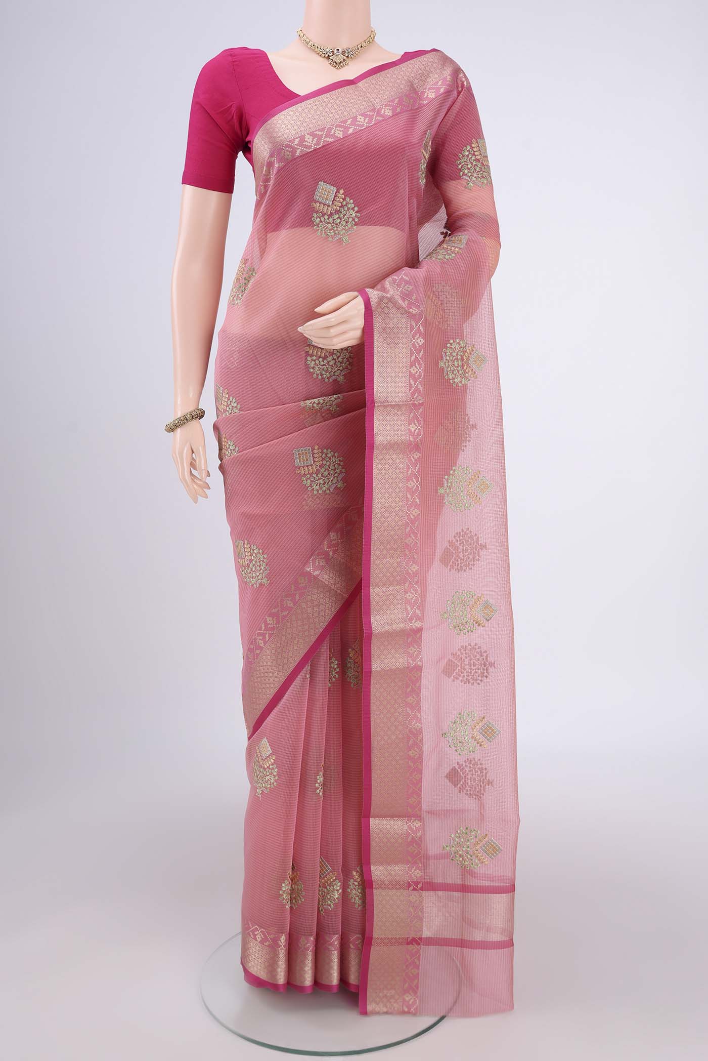 Pink Blended Kota Cotton Saree with Embroidery on the body and Zari Border.  displayed on a mannequin