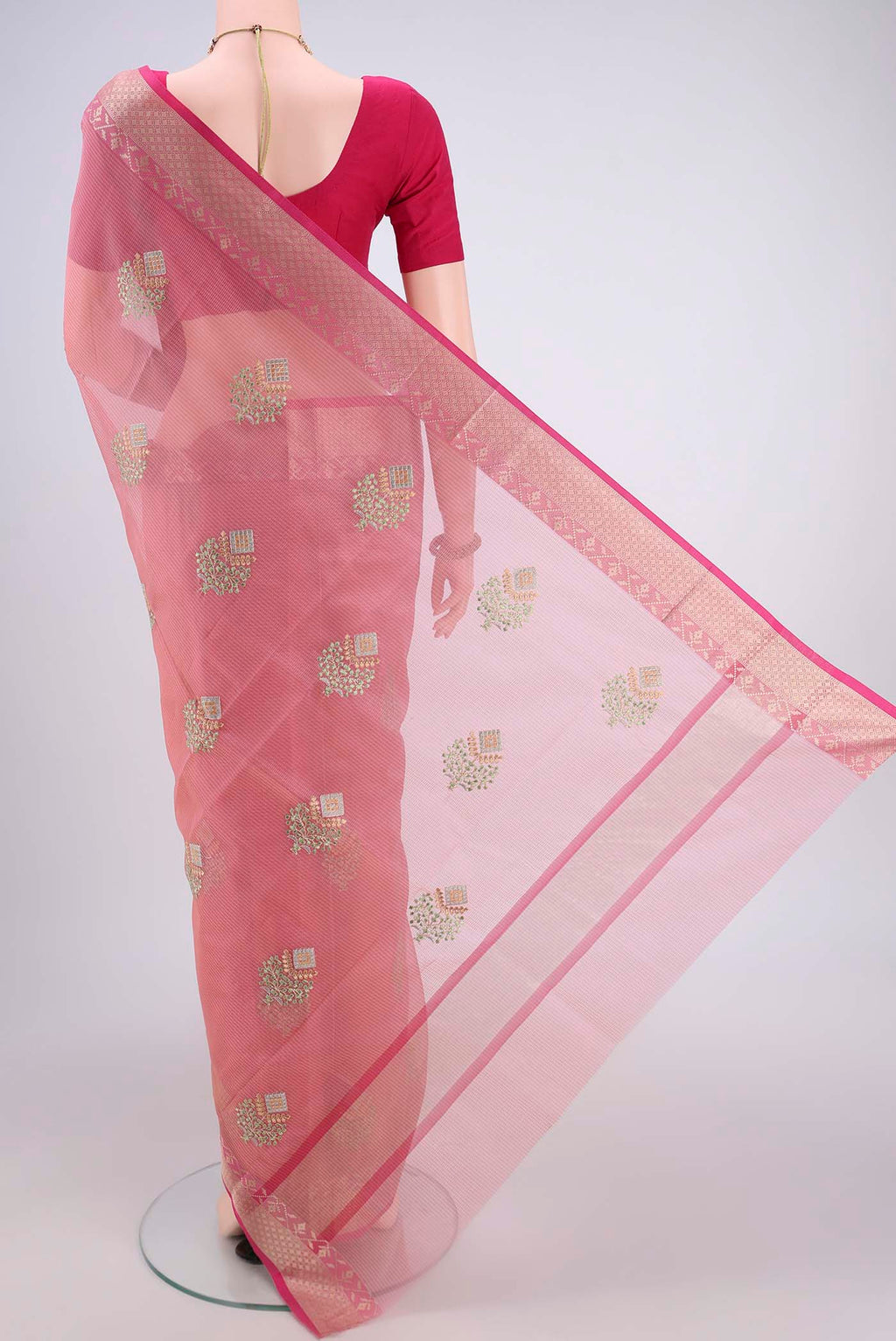 Flat view of Pink Blended Kota Cotton Saree with Embroidery on the body and Zari Border. 