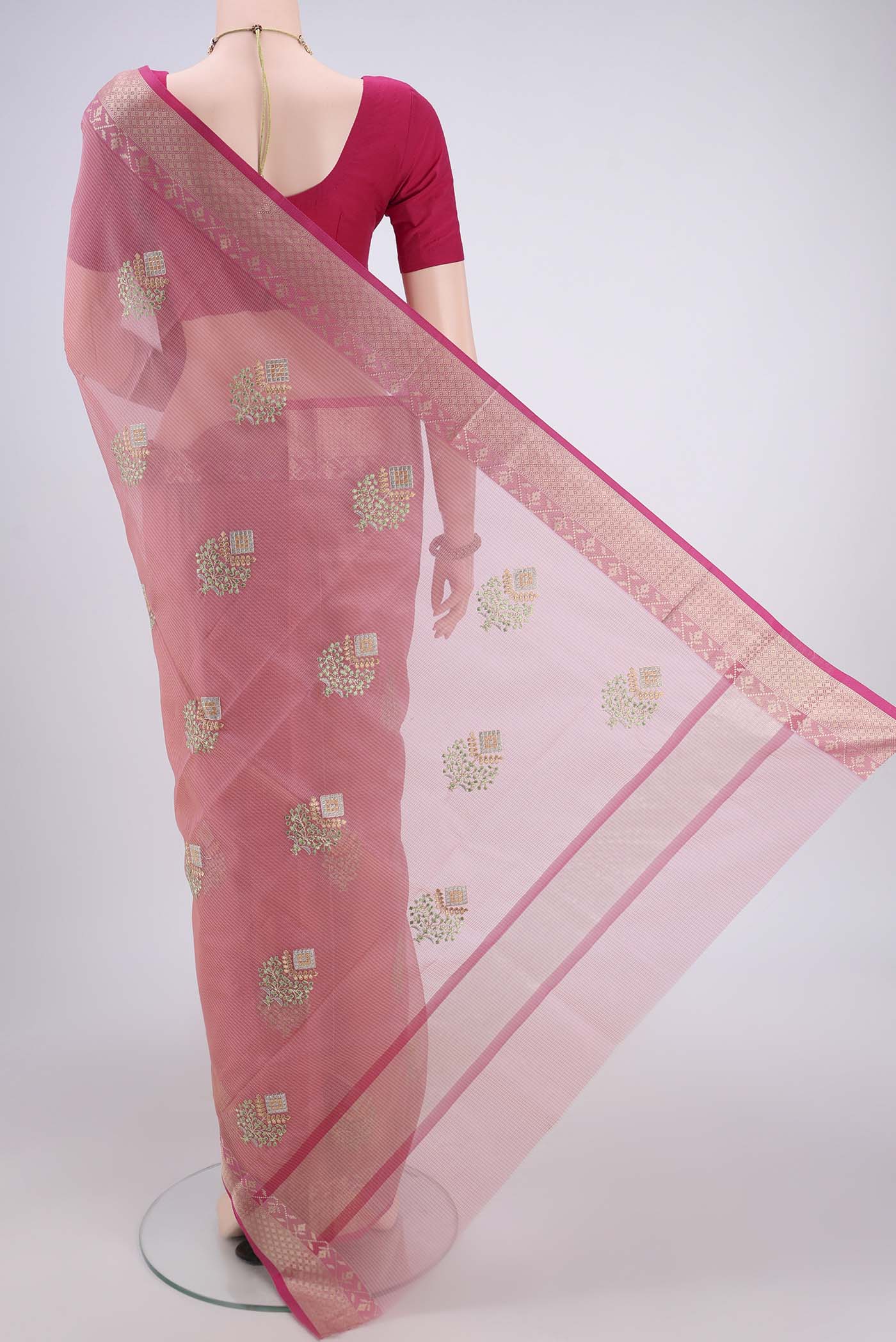 Flat view of Pink Blended Kota Cotton Saree with Embroidery on the body and Zari Border. 