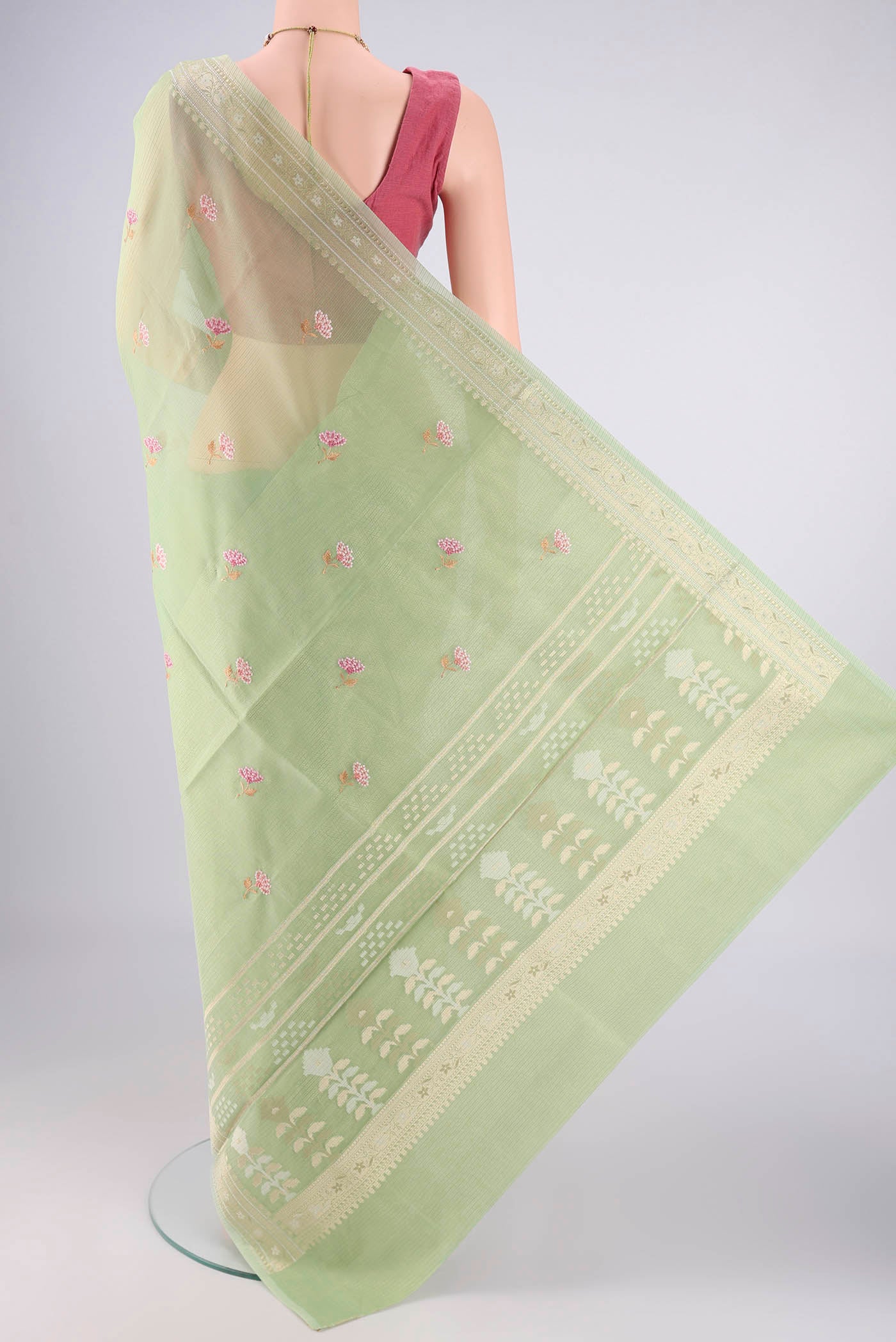 Flat view of Light Green Blended Kota Cotton Saree with Embroidery on the body and Zari Border. 