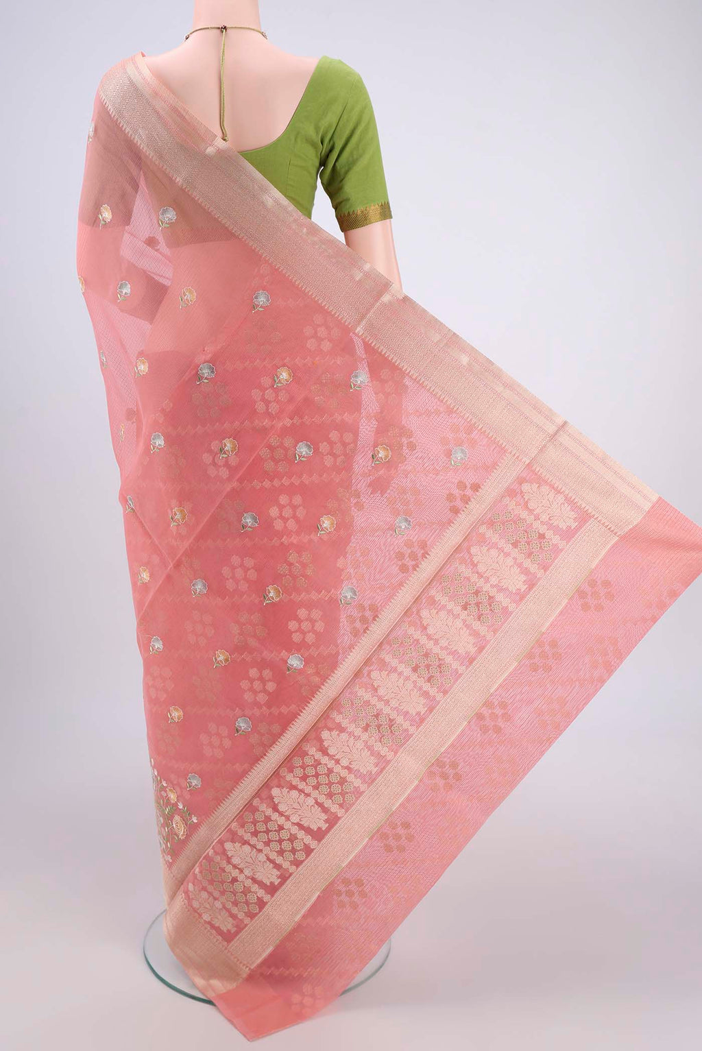 Flat view of Peach Blended Kota Cotton Saree with Embroidery on the body and Zari Border. 