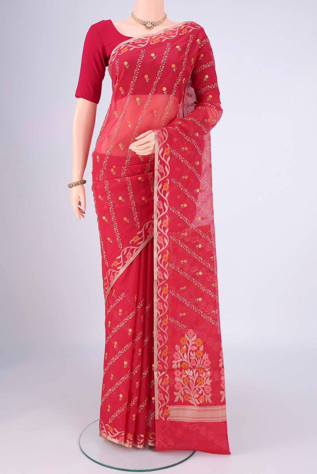 Red Blended Kota Cotton Saree with Embroidery on the body and Zari Border.  displayed on a mannequin