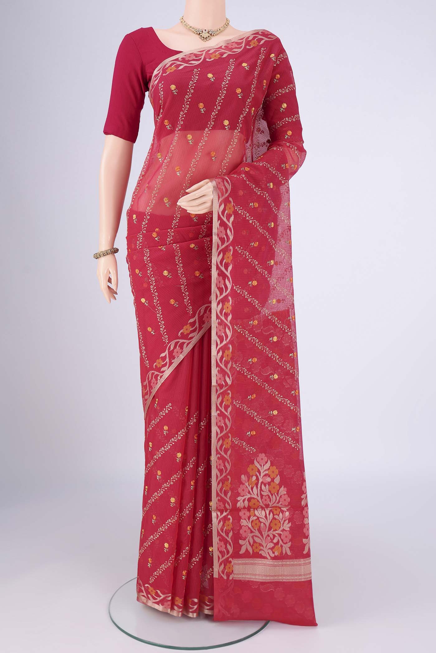Red Blended Kota Cotton Saree with Embroidery on the body and Zari Border.  displayed on a mannequin