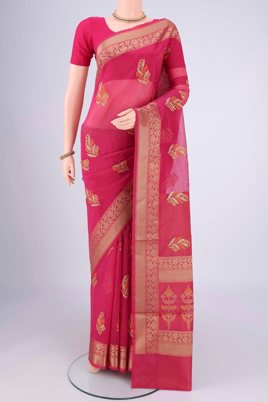 Rani Pink Blended Kota Cotton Saree with Embroidery on the body and Thread Border.  displayed on a mannequin