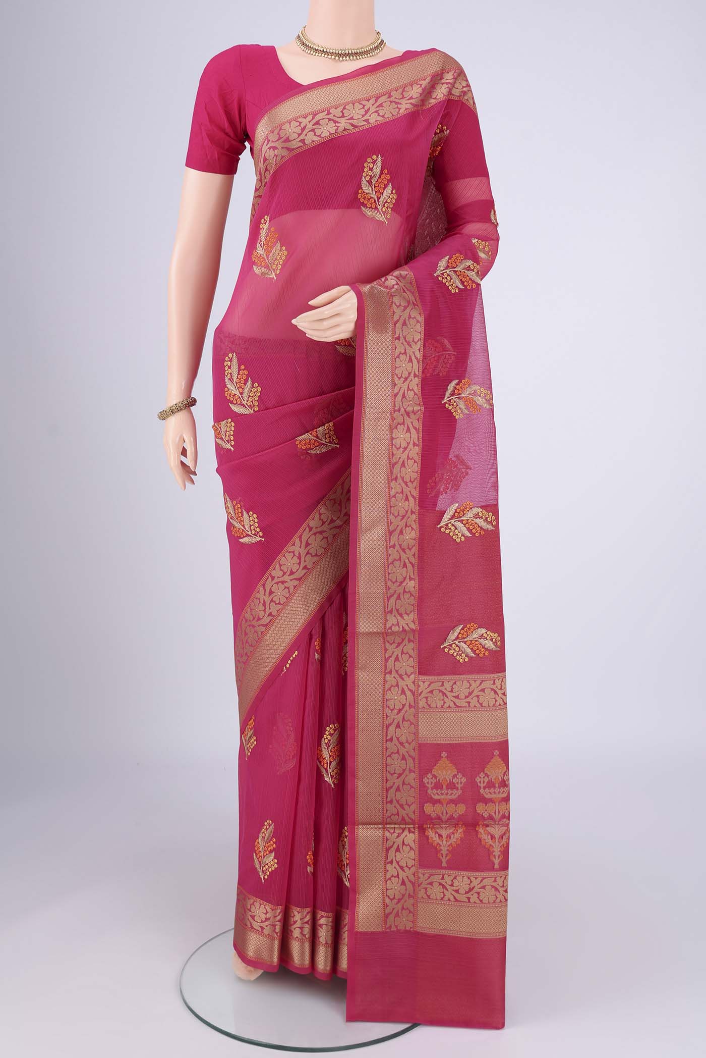 Rani Pink Blended Kota Cotton Saree with Embroidery on the body and Thread Border.  displayed on a mannequin