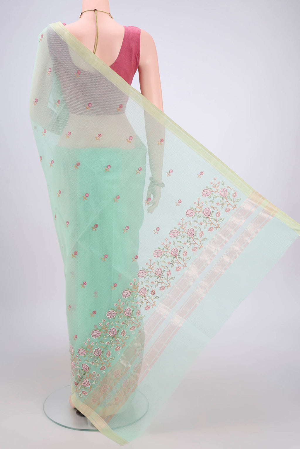 Flat view of Mint Green Blended Kota Cotton Saree with Embroidery on the body and Zari Border. 